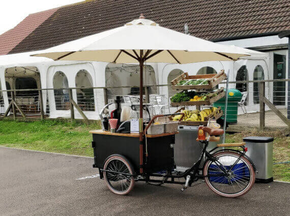 smoothie bike with umbrella for outdoor event